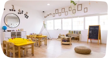 Step By Step Nursery in Dubailand, featuring a spacious classroom with natural lighting and activities overseen by Nursery Manager Tiffany Huxley.