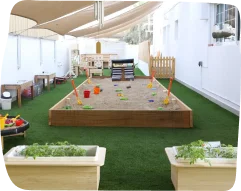Kids Academy Nursery ouutdoor play area garden and sand
